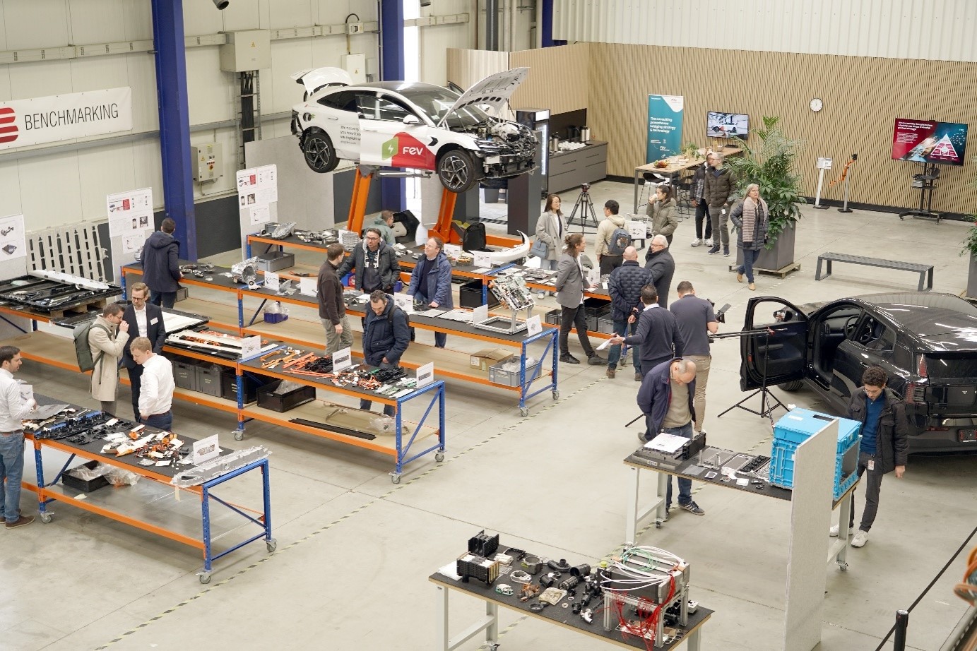 Humanoid Robotics at FEV: The FEV Bot Innovation Program Visitors exploring the FEV Benchmark Center in Aachen, where the FEV Bot humanoid robot is being developed and demonstrated for advanced robotics and functional safety use cases.